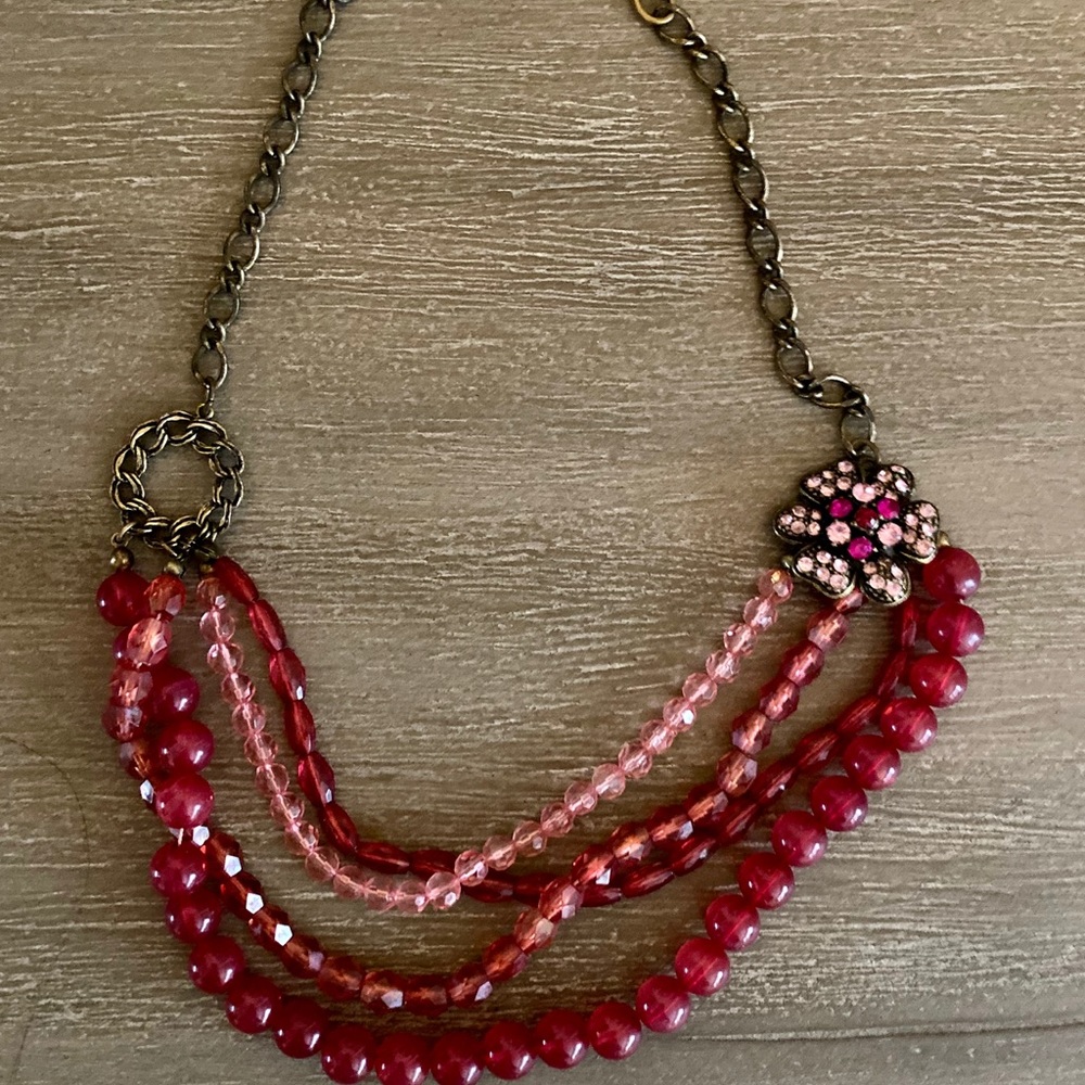 Pink layered beaded necklace with flower brooch